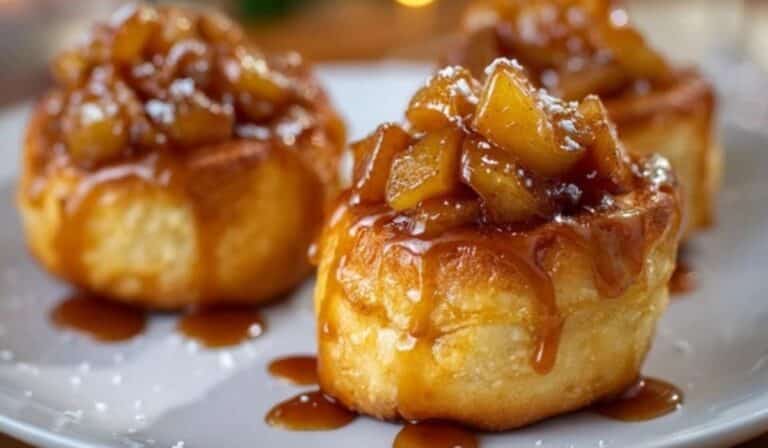 Apple Cheesecake Buns served with cinnamon apples and a glaze on top