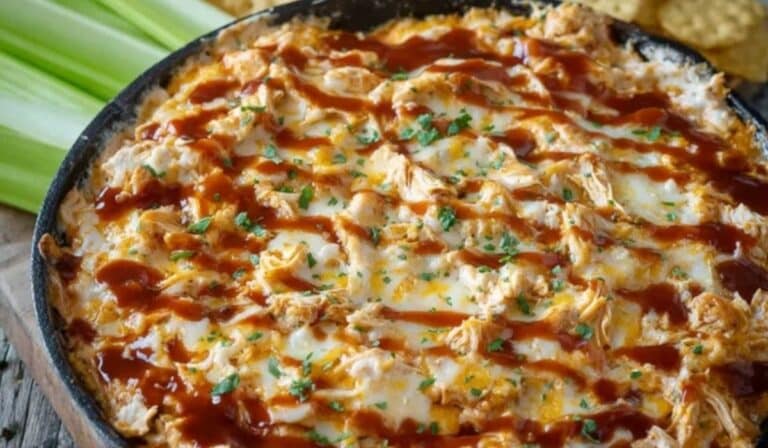 BBQ Chicken Dip hot skillet with melted cheese and chips