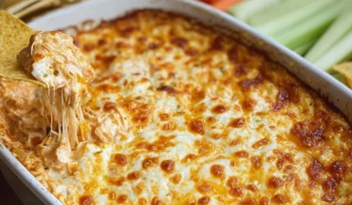 Easy Buffalo Chicken Dip served warm with tortilla chips and celery
