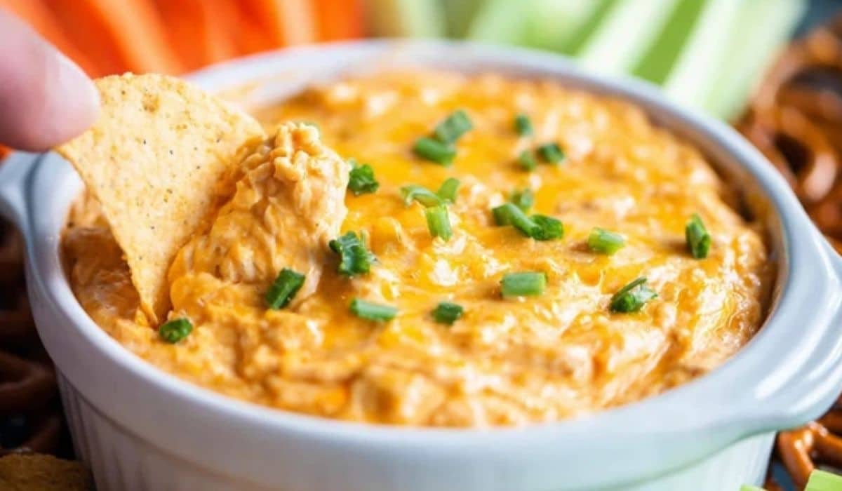 Buffalo Chicken Dip freshly baked with golden cheese and chips
