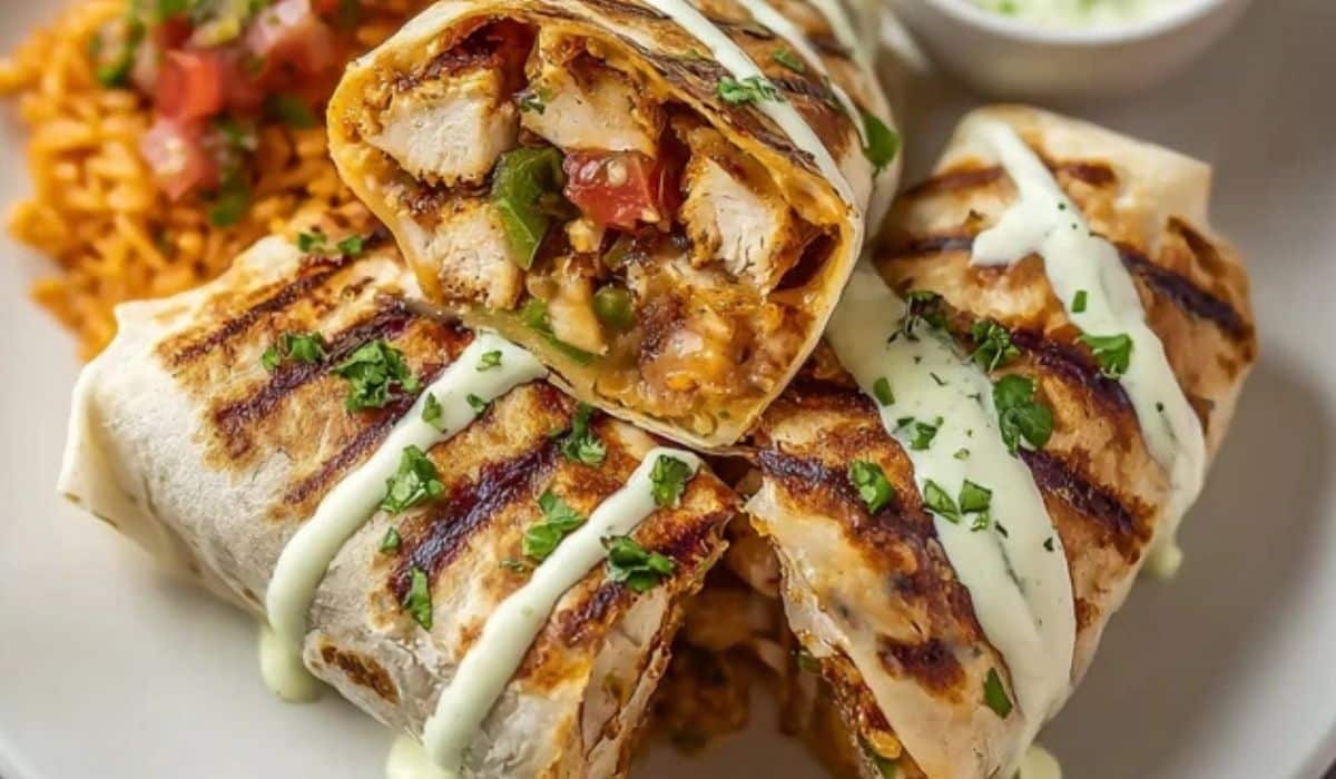 chipotle ranch grilled chicken burrito sliced open with sauce
