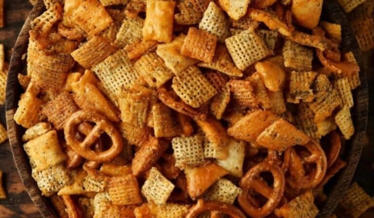 Cheesy Ranch Chex Mix in a rustic wooden bowl