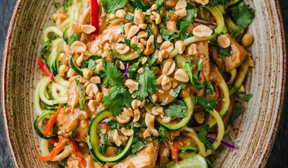 Peanut Chicken Zucchini Noodles in ceramic bowl