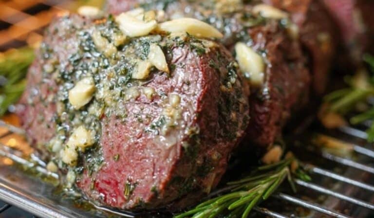 Garlic Butter Beef Tenderloin on wooden board