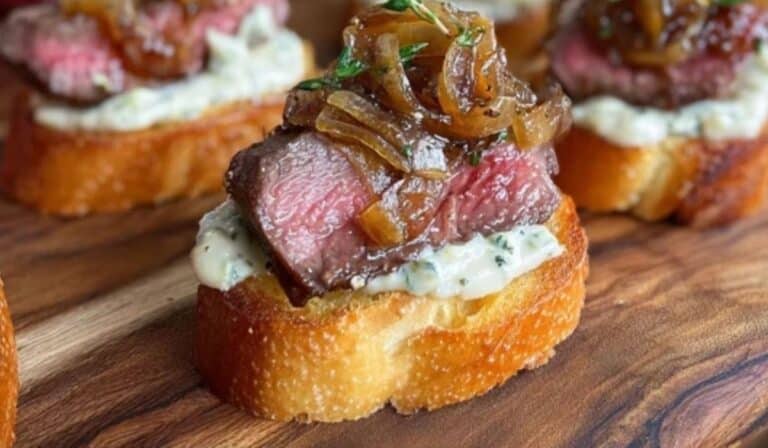 steak crostini with horseradish sauce and caramelized onions appetizer