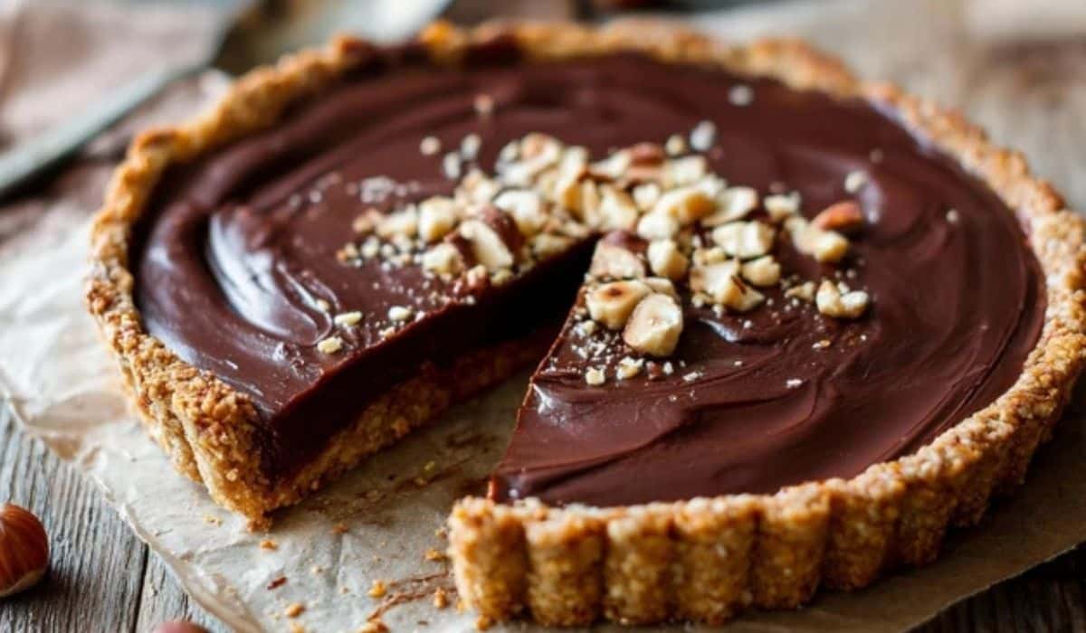 Nutella Tart with Toasted Hazelnut Crust on a wooden table