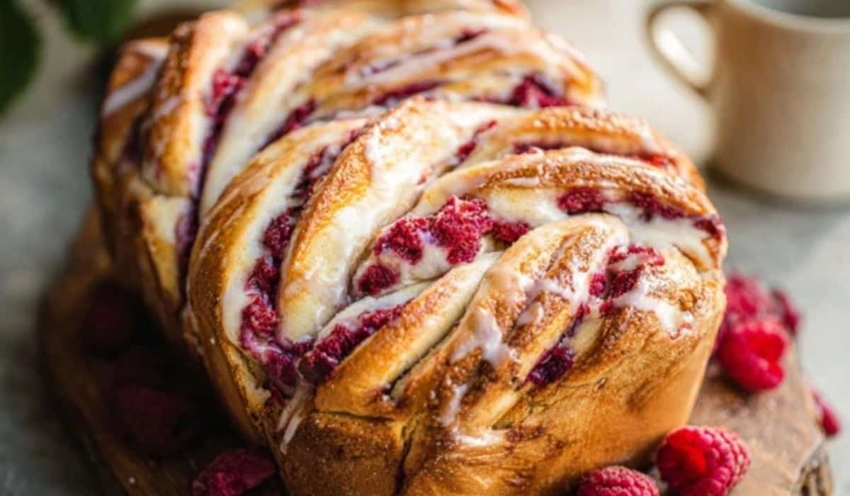 Raspberry Twist Bread loaf on wooden board