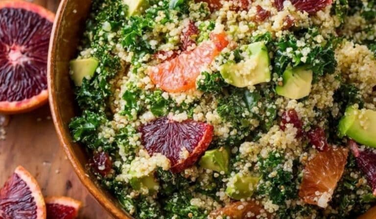 Blood Orange Avocado Quinoa & Kale Salad served in rustic bowl