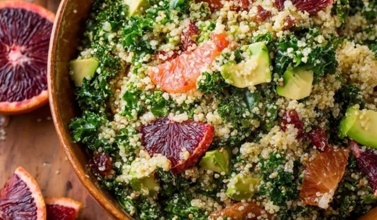 Blood Orange Avocado Quinoa & Kale Salad served in rustic bowl