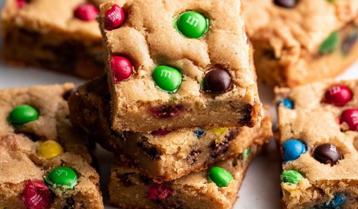 Soft-Baked M&M Cookie Bars stacked on a plate