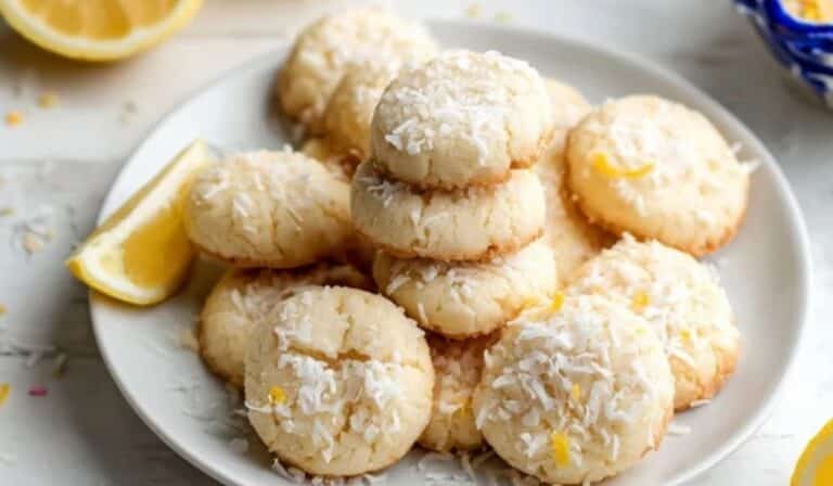 lemon coconut drop shortbread cookies on white plate