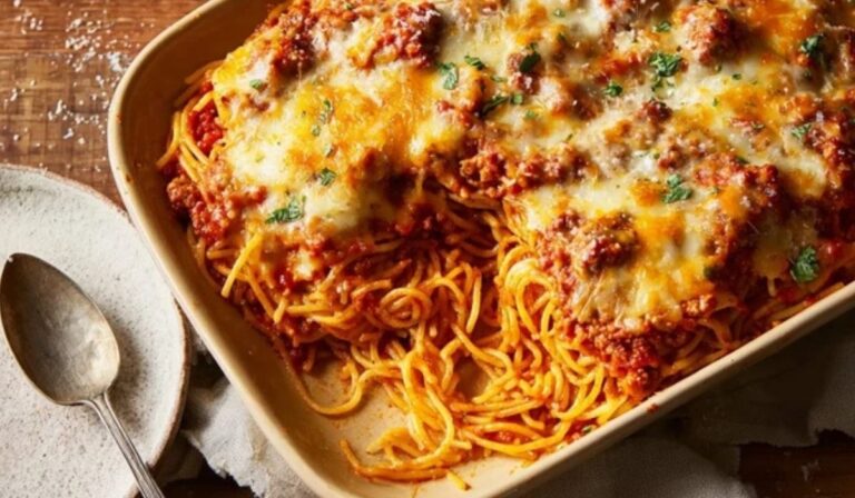 The Best Spaghetti Casserole baked with golden cheese in a 9x13 pan
