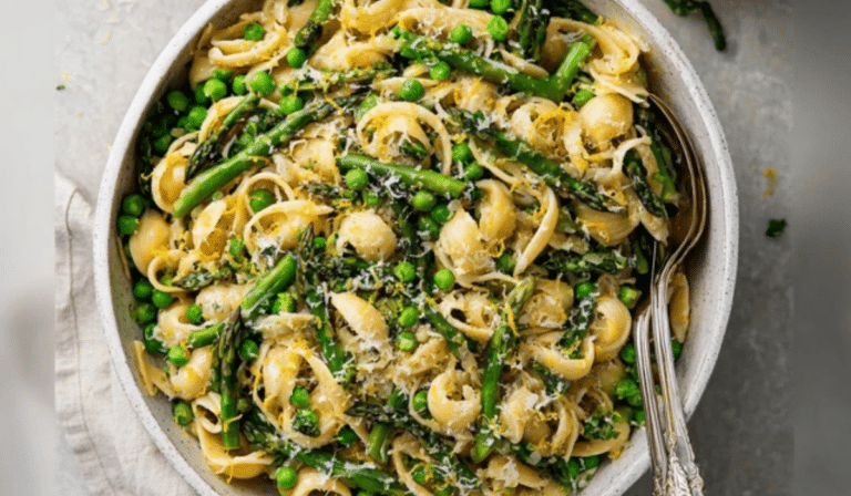 Spring Pasta with Peas and Asparagus in a bowl with lemon and parmesan