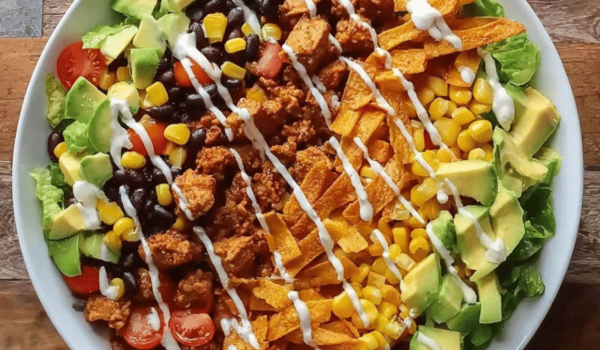 Southwestern Taco Salad with beef, beans, corn, avocado, and chipotle-lime dressing
