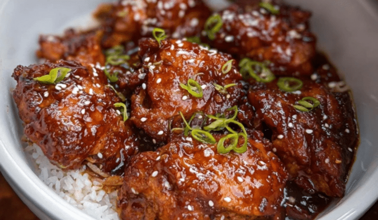 Slow Cooker Honey Garlic Chicken with sticky honey garlic sauce over rice