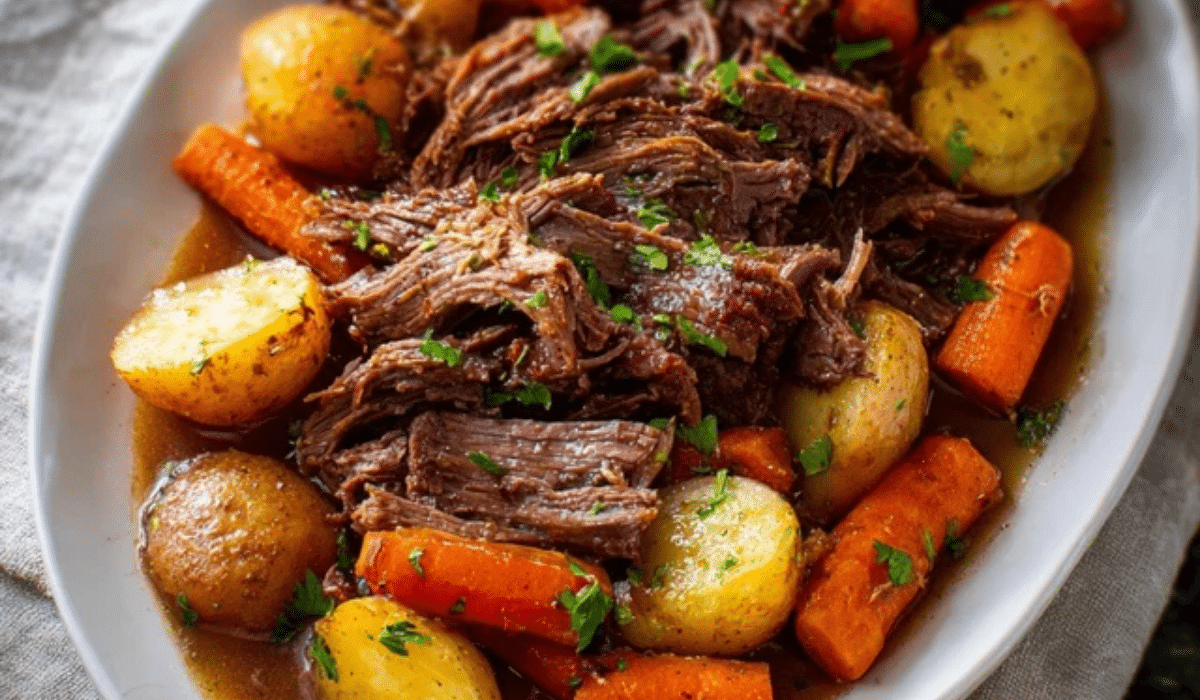 Perfect Slow Cooker Pot Roast with carrots and potatoes in rich gravy