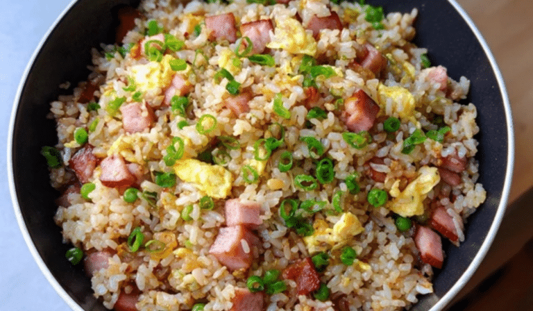 Ham and Egg Fried Rice in a skillet with fluffy eggs and diced ham