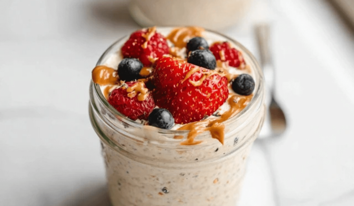 Protein overnight oats in a jar with berries and almond butter